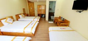 Giường trong phòng chung tại DALAMOON HOTEL