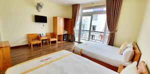 Giường trong phòng chung tại DALAMOON HOTEL