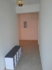 a hallway with a bench in a room at Apartments Marijana in Zavalatica
