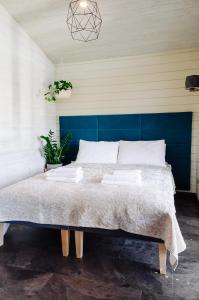 A bed or beds in a room at Holiday Houses LILLE`S with sauna