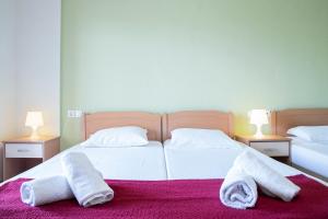 A bed or beds in a room at VILLA KETI