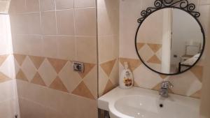 a bathroom with a sink and a mirror at Mini Location Chieti in Chieti