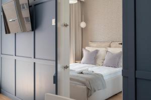 Łóżko lub łóżka w pokoju w obiekcie Apartament Bastion Wałowa 16