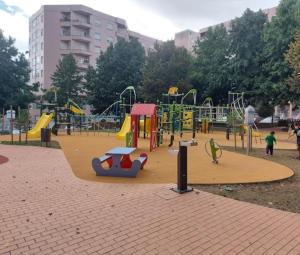a playground in a park with children playing in it at Diamante house com garagem privada in Braga