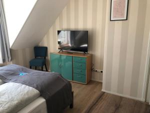 Televisyen dan/atau pusat hiburan di Residence De Kaaipoort appartementen