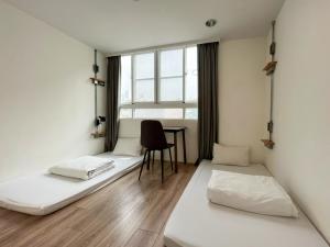 Katil atau katil-katil dalam bilik di Light Hostel