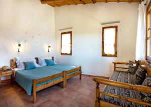 A bed or beds in a room at Villa Zoi Tzitzifes