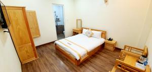 Giường trong phòng chung tại DALAMOON HOTEL