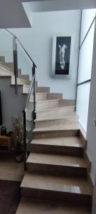 a staircase in a house with a picture on the wall at Excelente Dúplex de Lujo in Murcia