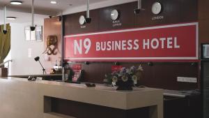 a nox business hotel sign above a counter at N9 Business Hotel Sdn Bhd in Nilai
