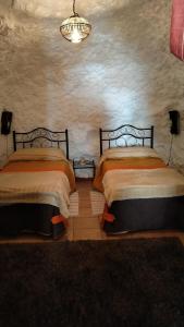 Posteľ alebo postele v izbe v ubytovaní Casa Cueva Sierra Nevada - Monachil