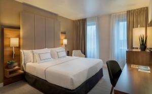 Giường trong phòng chung tại Meliá Düsseldorf