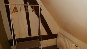 a stairway with a railing and a stair case at Nuits au Grenier de Chartres in Chartres