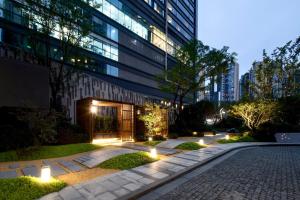 a courtyard with lights in front of a building at Primcasa Chengdu in Chengdu
