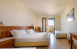Anastasia Hotel Stalis tesisinde bir odada yatak veya yataklar