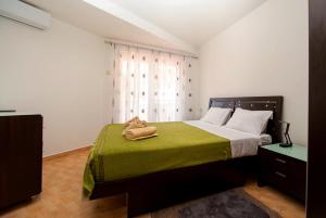 Postel nebo postele na pokoji v ubytování Apartment Elegija