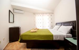 Postel nebo postele na pokoji v ubytování Apartment Elegija