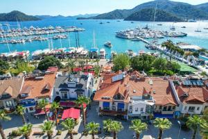 a view of a harbor with boats in the water at Gocek Unlu Hotel in Göcek