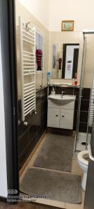 a bathroom with a sink and a toilet at Appartamento Natalia Verona in Verona