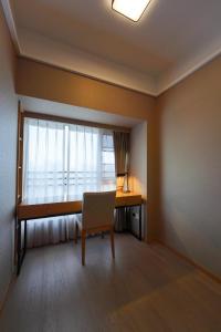 Postel nebo postele na pokoji v ubytování CM Serviced Apartment