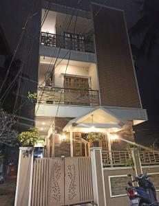 a house at night with a motorcycle parked in front of it at High Island Homestay in Cochin