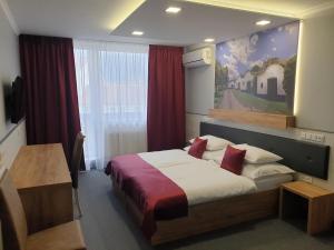 Posteľ alebo postele v izbe v ubytovaní Hotel Strážnice