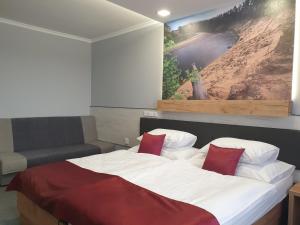 Posteľ alebo postele v izbe v ubytovaní Hotel Strážnice