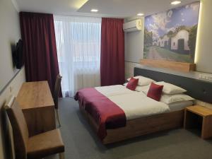 Posteľ alebo postele v izbe v ubytovaní Hotel Strážnice
