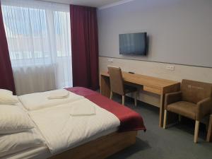 Posteľ alebo postele v izbe v ubytovaní Hotel Strážnice