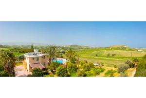 an aerial view of a house with a pool at Villa Noni Large Private Pool AC WiFi in Polis Chrysochous