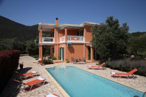 a villa with a swimming pool and a house at Pantheon & Danae Luxury Villas in Sivota