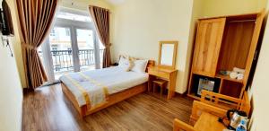 Giường trong phòng chung tại DALAMOON HOTEL