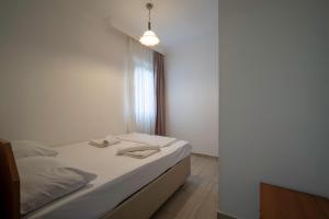 Tempat tidur dalam kamar di Datça Işık Apart