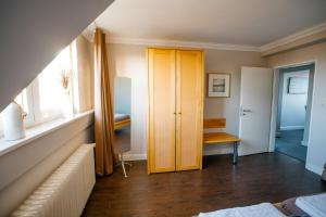 a room with a yellow door and a window at Ferienwohnung Nr. 9 in Borkum