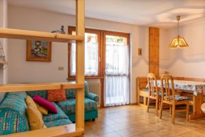 a living room with a couch and a table at Casa Maura in Soraga