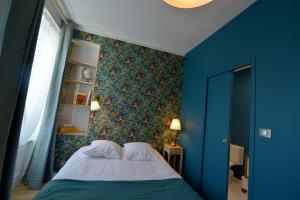 Letto o letti in una camera di Hôtel Le Tiburon