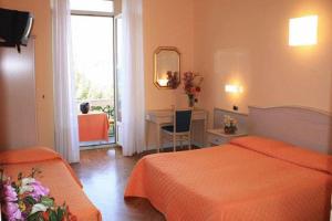 Voodi või voodid majutusasutuse Hotel Excelsior Splendide toas
