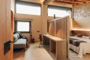A bed or beds in a room at Hotel Boutique El Mariner