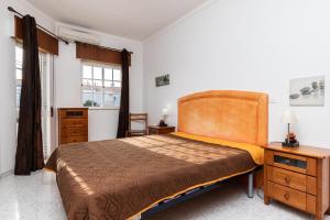 Ένα ή περισσότερα κρεβάτια σε δωμάτιο στο Lotamar Apartment by ALGARVEMANTA