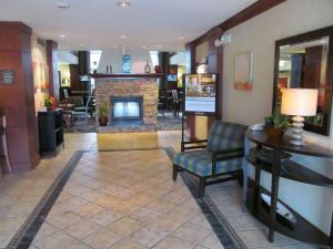 a lobby of a hotel with a fireplace at Sonesta ES Suites San Antonio Northwest Medical Center in San Antonio