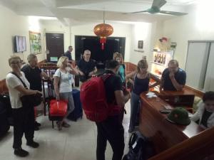 a group of people standing in a room at Family Transit Hotel in Thach Loi