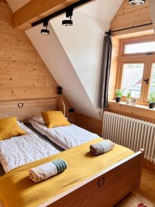 a bedroom with two beds in a attic at Apartament Tatrzański in Zakopane