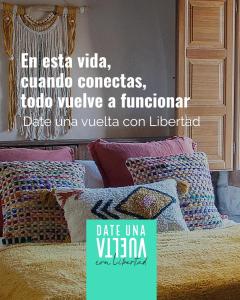 a poster of a bed with pillows on it at Precioso loft rural con estufa de leña panorámica in Torre del Compte