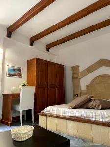 Säng eller sängar i ett rum på Le case di Nunzia