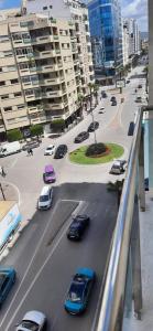 a view of a city street with cars and buildings at Beautiful apartment close Playa beach - Tanger N41 in Tangier