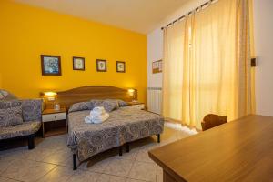 Postel nebo postele na pokoji v ubytování Agriturismo LA FATA