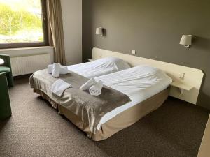 Katil atau katil-katil dalam bilik di Hotel de Vaart