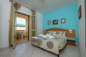 Postel nebo postele na pokoji v ubytování Agriturismo LA FATA