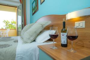 Postel nebo postele na pokoji v ubytování Agriturismo LA FATA