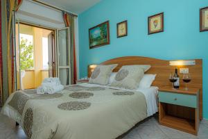 Postel nebo postele na pokoji v ubytování Agriturismo LA FATA